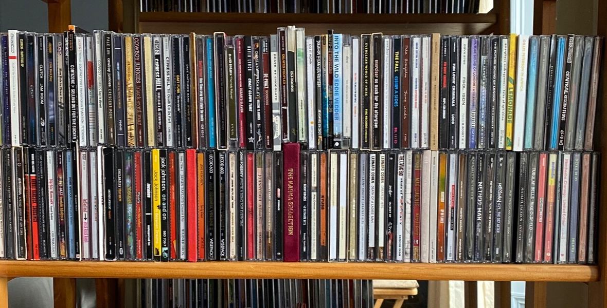 Used CDs sorted on shelves by artist, the kind of rock, hip-hop and alternative CD collection Found Sound Records buys in Miami and South Florida